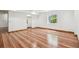 Large, unfurnished basement features a garden window, laminate floors, and an open closet at 4720 S Grant St, Englewood, CO 80113