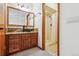 Bathroom with glass vessel sink, granite countertop and walk-in shower stall at 4720 S Grant St, Englewood, CO 80113