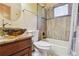 Bathroom features a unique glass vessel sink and shower with decorative tile at 4720 S Grant St, Englewood, CO 80113