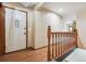 Welcoming entryway featuring wood flooring, a decorative front door, and staircase access at 4720 S Grant St, Englewood, CO 80113