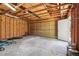 Spacious two-car garage with exposed rafters, offering plenty of room for vehicles and storage at 4720 S Grant St, Englewood, CO 80113