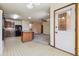 Open concept kitchen view with breakfast nook, adjacent living area, and tile flooring at 4720 S Grant St, Englewood, CO 80113