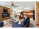 Open-concept living area seamlessly connecting the kitchen, dining, and fireplace area at 4720 S Grant St, Englewood, CO 80113