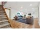 Finished basement with a spacious open floor plan, recessed lighting, and wood floors at 4720 S Grant St, Englewood, CO 80113
