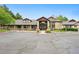 The community clubhouse offers a welcoming entrance and ample parking for residents and guests at 7489 S Quail Cir # 814, Littleton, CO 80127