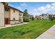 Beautiful townhome with a well-maintained lawn and stone accents on the exterior facade at 7489 S Quail Cir # 814, Littleton, CO 80127