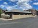 Row of detached garages for condo residents with manicured landscaping at 7489 S Quail Cir # 814, Littleton, CO 80127