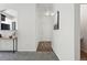 Inviting hallway with modern finishes, connecting to the kitchen and showcasing the home's neutral color palette at 7489 S Quail Cir # 814, Littleton, CO 80127