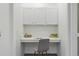 Dedicated home office space with built-in desk, storage cabinets, and a comfortable workspace at 7489 S Quail Cir # 814, Littleton, CO 80127