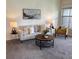 Cozy living room with neutral tones, stylish decor, and ample natural light from the nearby window at 7489 S Quail Cir # 814, Littleton, CO 80127