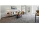 Serene living room with plush carpet, neutral colors, and plenty of natural light at 7489 S Quail Cir # 814, Littleton, CO 80127