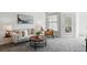 Cozy living room with neutral decor and comfortable seating arrangements at 7489 S Quail Cir # 814, Littleton, CO 80127