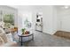 Bright living room with neutral tones, plush carpet, and views to the outside at 7489 S Quail Cir # 814, Littleton, CO 80127