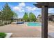 Inviting community pool area with a pergola, water features, and comfortable lounging space at 7489 S Quail Cir # 814, Littleton, CO 80127