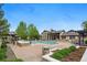 A serene community pool with stone accents and lush greenery, creating a relaxing atmosphere at 7489 S Quail Cir # 814, Littleton, CO 80127