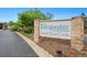Fallingwater Condominiums sign amidst lush greenery, marking the entrance to the community at 7489 S Quail Cir # 814, Littleton, CO 80127