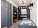 This bedroom features a closet, a built in desk, and an orange ottoman at 4948 Cameyo Rd, Indian Hills, CO 80454