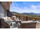Relaxing deck area with views of the mountains, and nice patio furniture at 4948 Cameyo Rd, Indian Hills, CO 80454