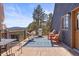 Outdoor deck featuring comfortable seating, a hammock, and a grill, perfect for enjoying scenic views at 4948 Cameyo Rd, Indian Hills, CO 80454