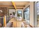 Dining room with a custom wood table and mountain views at 4948 Cameyo Rd, Indian Hills, CO 80454