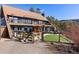 Stunning two-story home with a fenced-in yard, and an outdoor seating area at 4948 Cameyo Rd, Indian Hills, CO 80454