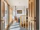 Bright foyer with hardwood floors, with a view from the front door, and a spiral staircase at 4948 Cameyo Rd, Indian Hills, CO 80454