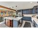 Elegant kitchen showcasing custom cabinets, granite countertops and modern appliances at 4948 Cameyo Rd, Indian Hills, CO 80454