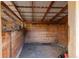 Interior view of a rustic stall within the outbuilding, ready for storage or livestock at 4948 Cameyo Rd, Indian Hills, CO 80454