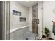 Walk-in shower with mosaic tile floors and custom tiled walls with a built-in bench at 4948 Cameyo Rd, Indian Hills, CO 80454