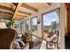 Cozy sitting area with large windows offering stunning mountain views and natural light at 4948 Cameyo Rd, Indian Hills, CO 80454