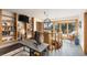 A spacious sitting room with hardwood floors, a spiral staircase, and a nice view at 4948 Cameyo Rd, Indian Hills, CO 80454