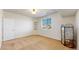 Neutral bedroom featuring a window, carpeted floors, and a closet at 8199 W 67Th Ave, Arvada, CO 80004