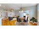Stylish dining area boasts hardwood floors and offers an open view into the living room, seamlessly combining style and functionality at 8199 W 67Th Ave, Arvada, CO 80004