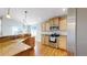 Bright kitchen features stainless steel appliances, granite countertops, and hardwood floors, combining style and functionality at 8199 W 67Th Ave, Arvada, CO 80004