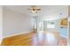 Bright and airy living room featuring hardwood floors, large windows for natural light, and an open floor plan great for entertaining at 8199 W 67Th Ave, Arvada, CO 80004