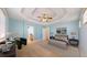 Spacious main bedroom features a tray ceiling, neutral carpet, and ensuite bathroom access at 8199 W 67Th Ave, Arvada, CO 80004