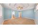 Large main bedroom features a tray ceiling, carpet, and a light blue paint scheme at 8199 W 67Th Ave, Arvada, CO 80004