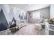 Playful Bedroom with a crib, rocker, and charming dinosaur-themed decor, creating a delightful space at 3879 N Shawnee St, Aurora, CO 80019