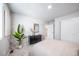 Bright bedroom features neutral walls, carpet floors, dresser, and white closet doors at 3879 N Shawnee St, Aurora, CO 80019