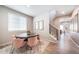 This dining room features modern decor, a grey table, and six pink chairs at 3879 N Shawnee St, Aurora, CO 80019