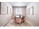 Chic dining room featuring a round table, plush pink chairs, and modern artwork for stylish dining at 3879 N Shawnee St, Aurora, CO 80019