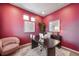 Home office with pink walls, desk, and chair, accented by modern decor at 3879 N Shawnee St, Aurora, CO 80019
