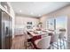 Beautiful kitchen featuring an island, stylish seating, and stainless steel appliances at 3879 N Shawnee St, Aurora, CO 80019