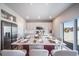 Spacious kitchen with an island, stainless steel refrigerator, and sliding doors to the backyard at 3879 N Shawnee St, Aurora, CO 80019