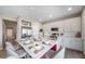 Bright kitchen with a spacious island, stainless steel appliances, and a modern design at 3879 N Shawnee St, Aurora, CO 80019