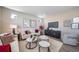 Bright living room with modern furniture, neutral tones, and stylish decor for comfortable living at 3879 N Shawnee St, Aurora, CO 80019