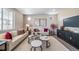 Comfortable living room with tasteful decor, modern furnishings, and a serene ambiance at 3879 N Shawnee St, Aurora, CO 80019