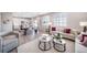 Open-concept living area showcases a harmonious blend of living and dining spaces with ample natural light at 3879 N Shawnee St, Aurora, CO 80019