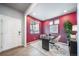 This home office features a modern desk, sleek chair, and a brightly lit window at 3879 N Shawnee St, Aurora, CO 80019
