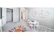 Inviting playroom with a colorful rug, table, chairs, and cheerful alphabet wall decals for educational fun at 3879 N Shawnee St, Aurora, CO 80019